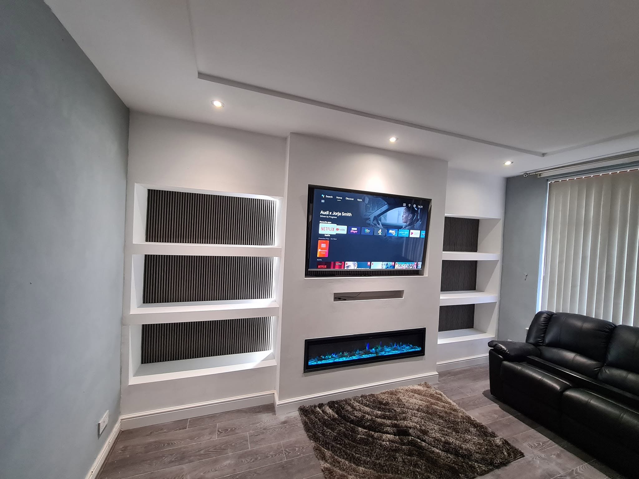 Bespoke media wall with electric fireplace fitted in Oldham living room