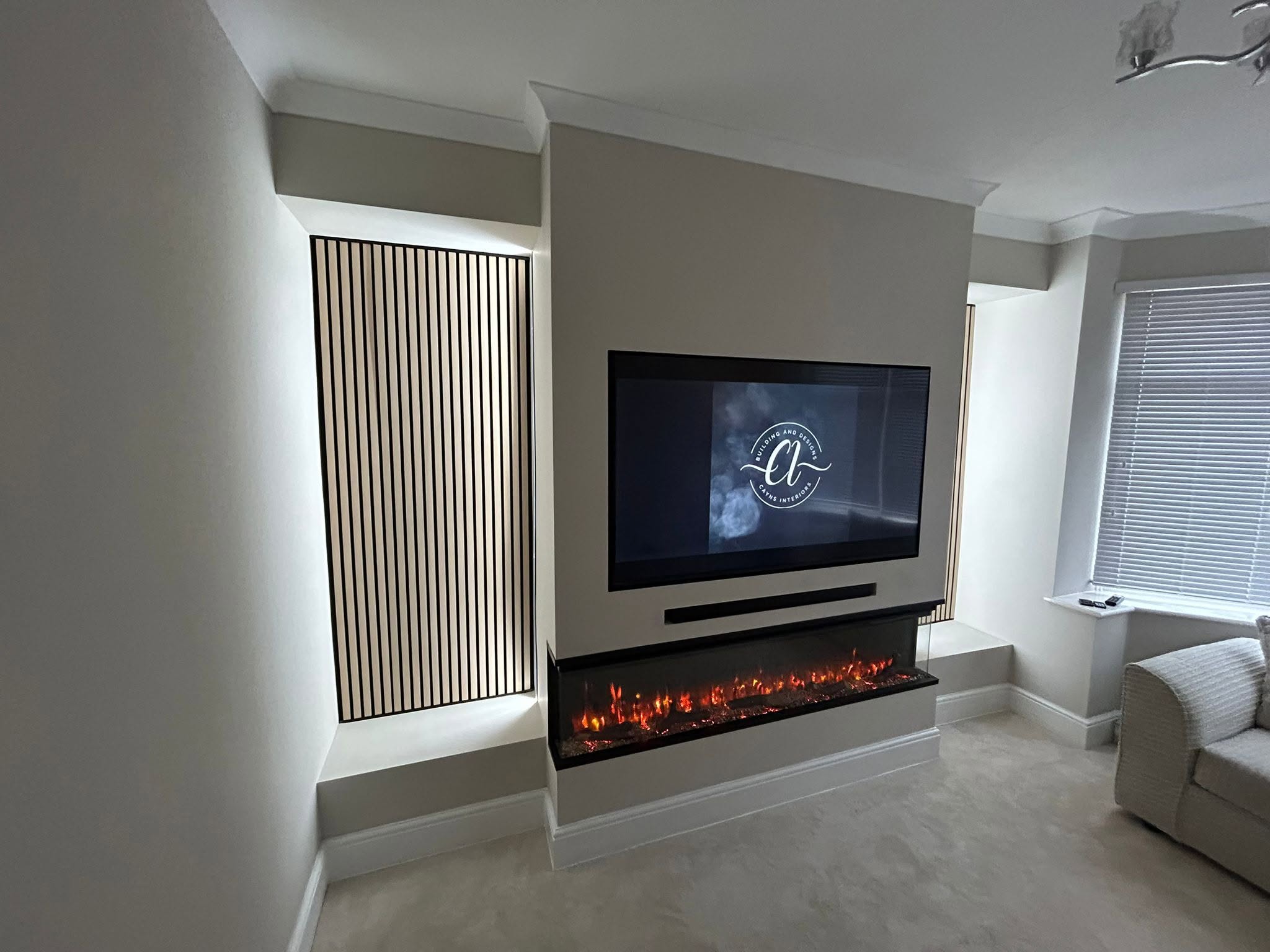 Cayns Mediawalls craftsman finishing a bespoke feature wall